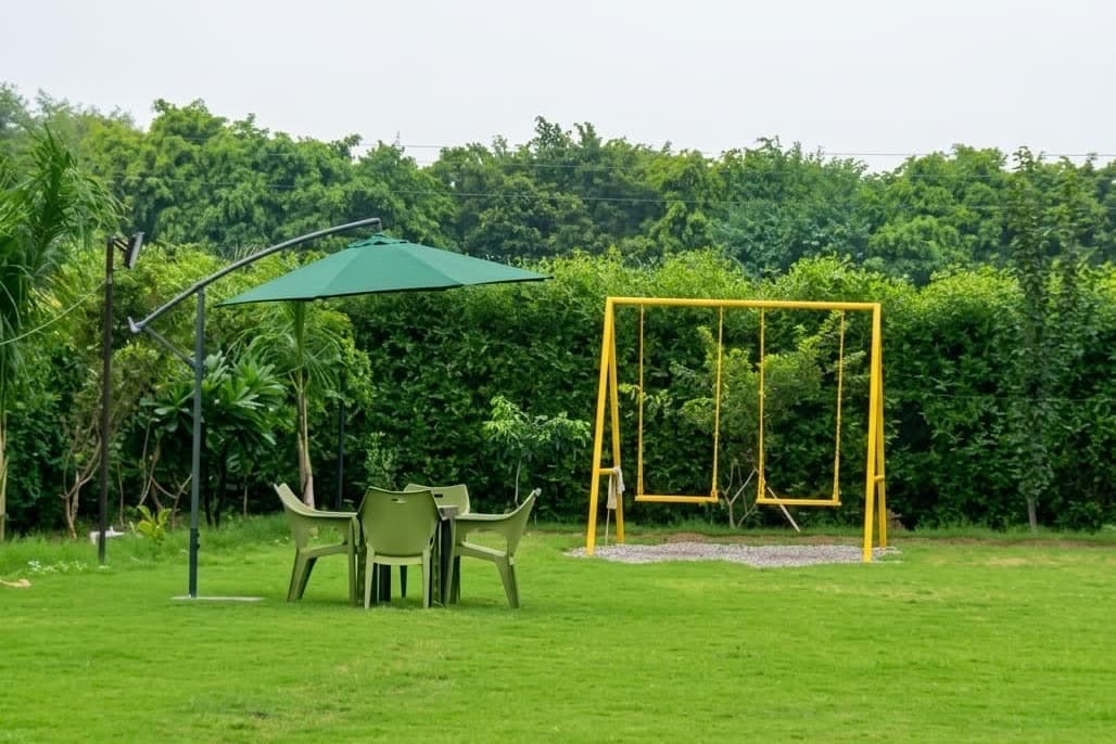 Garden table and chairs on the lawn at Sweet Orchard Farm